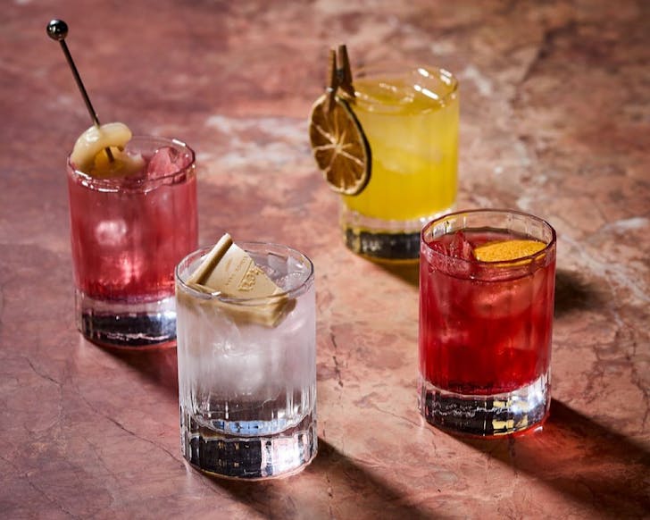 Four dainty cocktails. 