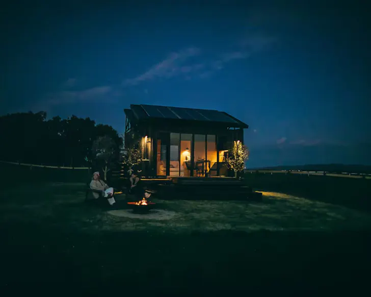 A view of Larnook tiny home in Victoria at night time 