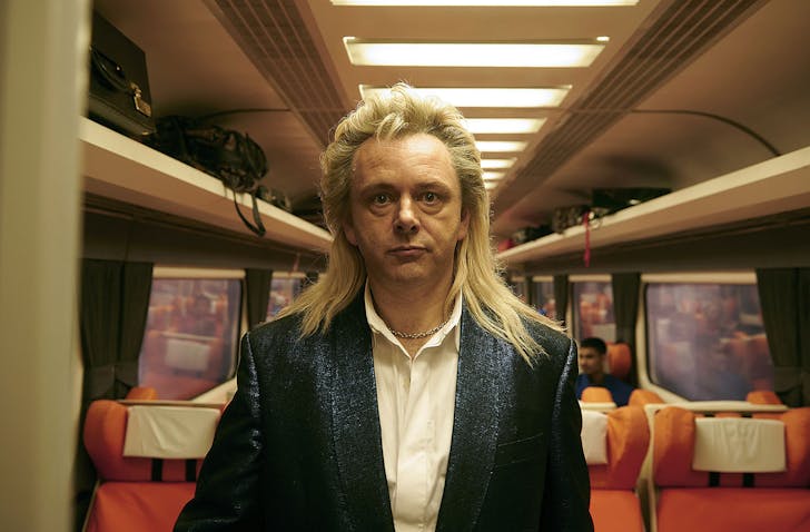 Someone stands in a train carriage looking bewildered. One of the best Christmas movies on Neon.