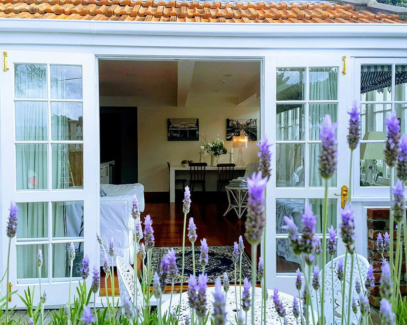 A glimpse of the romantic, lavender-lined French doors at the Kelburn Lavender Apartment, one of the best airbnbs in Wellington. 