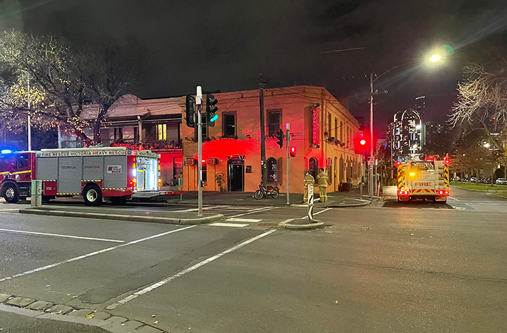 The outside of Leonardo's Pizza Palace with firetrucks out front.