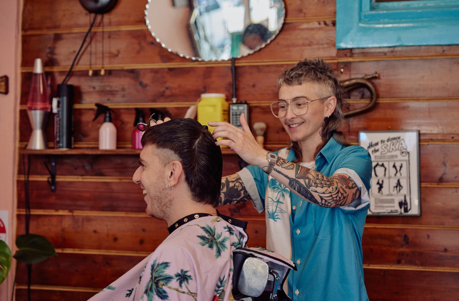 Barber cutting customer's hair
