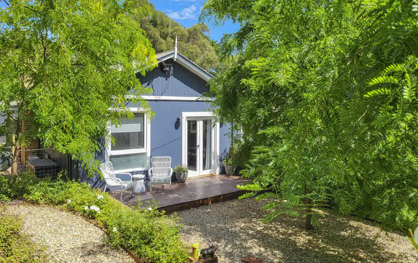 A cottage and small deck, one of the best pet-friendly Airbnbs in Victoria.