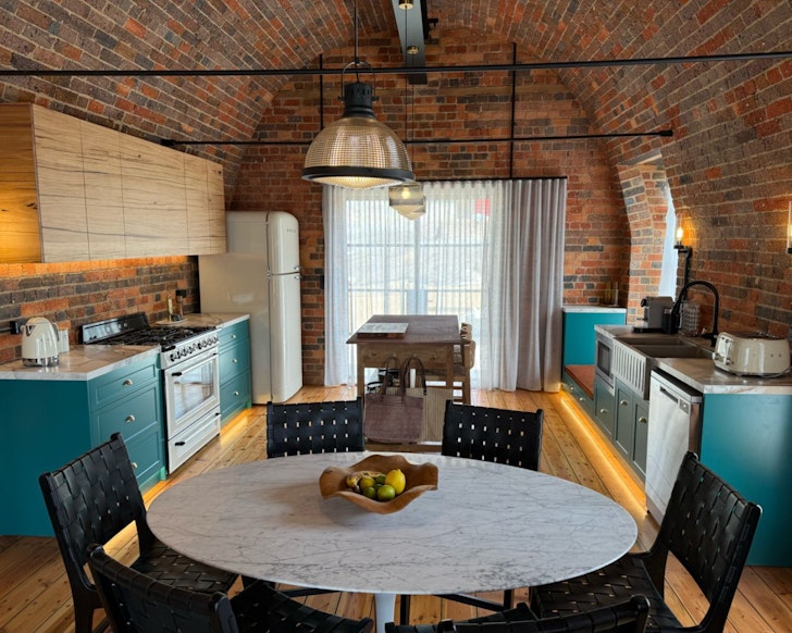 The red brick interior at Logue one of the best Airbnb accommodation options Daylesford