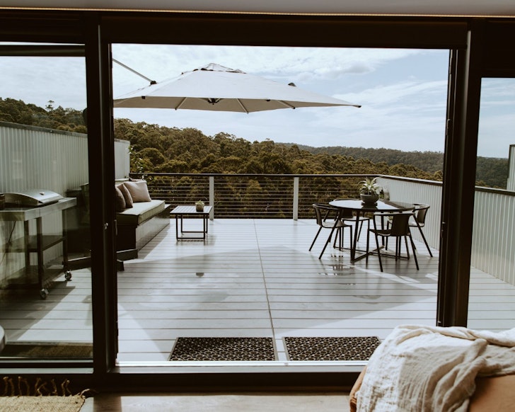 The view of the deck from the bed at Lorne Lifestyle Container One one of the best Airbnb accommodation options Lorne