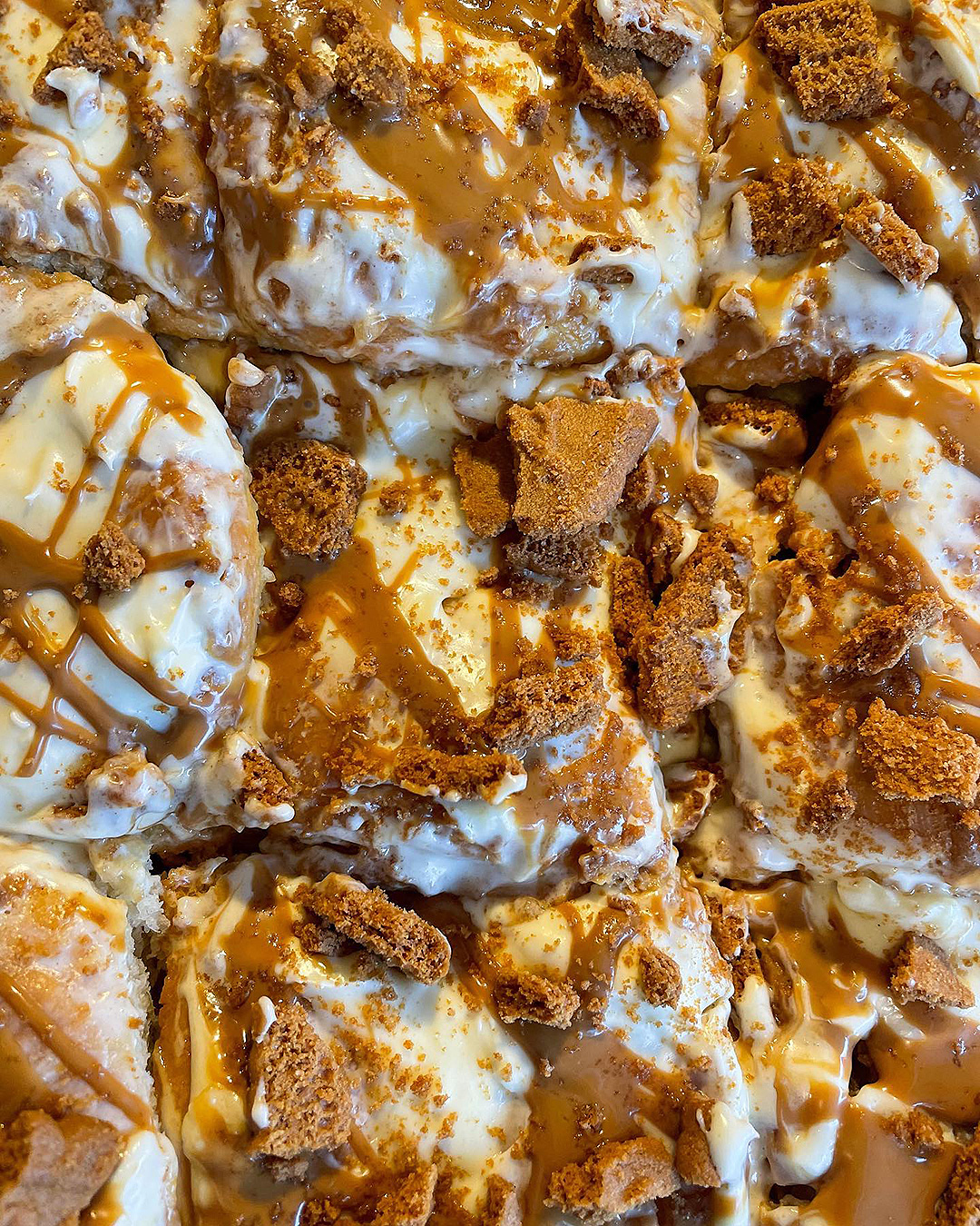 A close up of Lot Nineteen's cinnamon buns with biscoff on top.