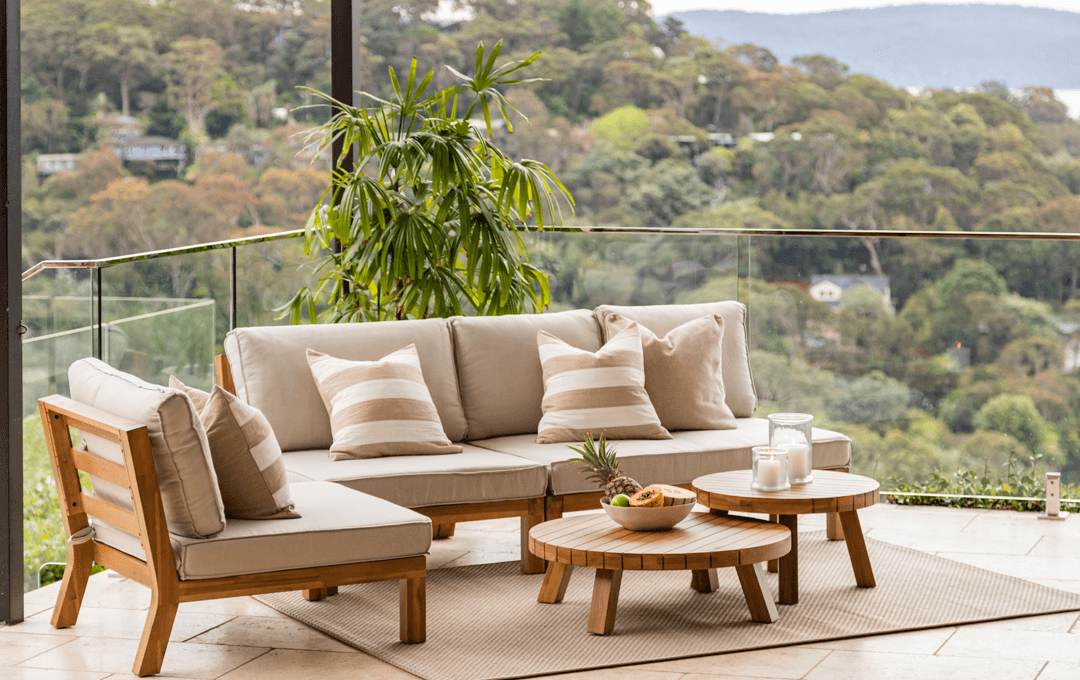 An outdoor couch on a balcony. 