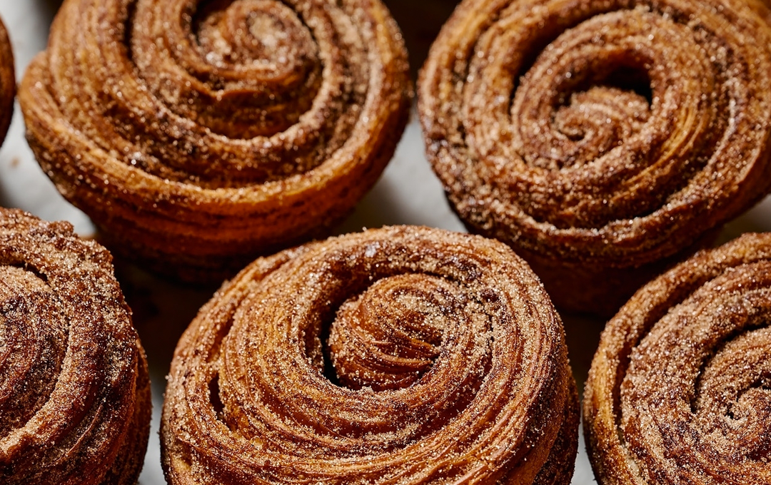A tray of perfectly golden and sugar-crusted cinnamon scrolls in Melbourne.