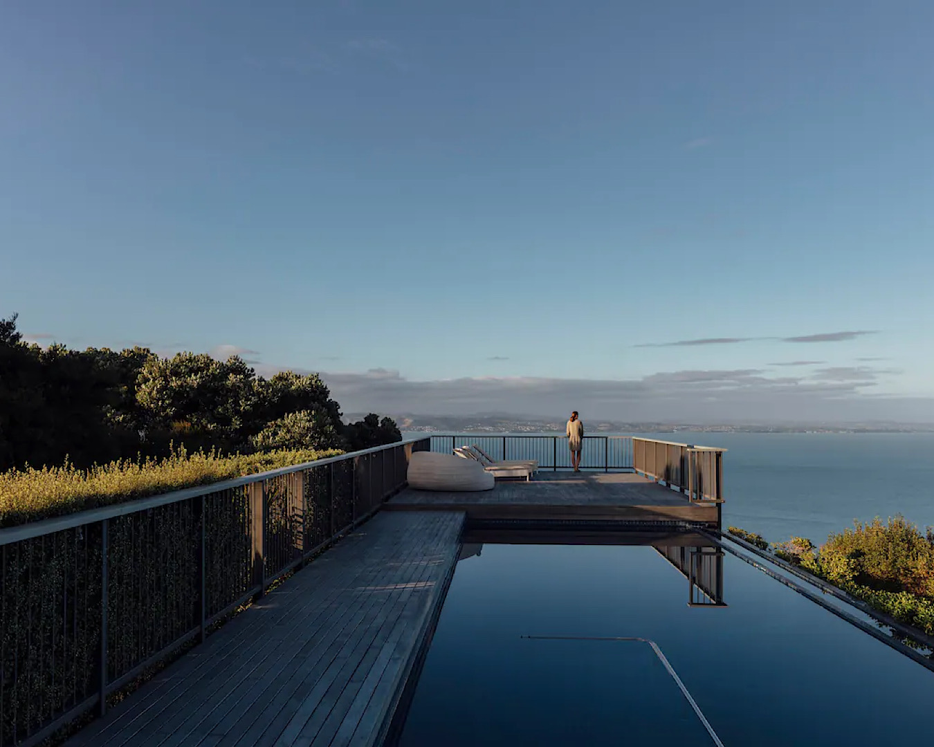 A jaw-droppings gorgeous infinity pool with a deck overlooking the Hauraki Gulf. 