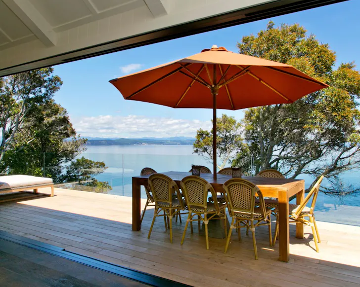 The table on the deck at Luxurious Villa best lakefront Airbnbs NZ