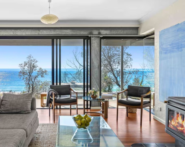 A view of the living space looking out to the water at Luxury Beachfront House Airbnb one of the best accommodation options near Batemans Bay