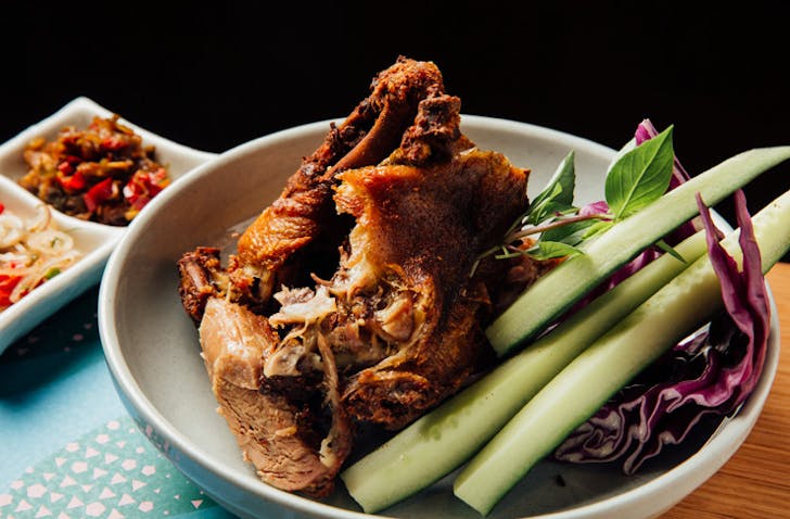 A bowl of roasted shredded duck with cucumber, a premium Indonesian restaurant Melbourne. 
