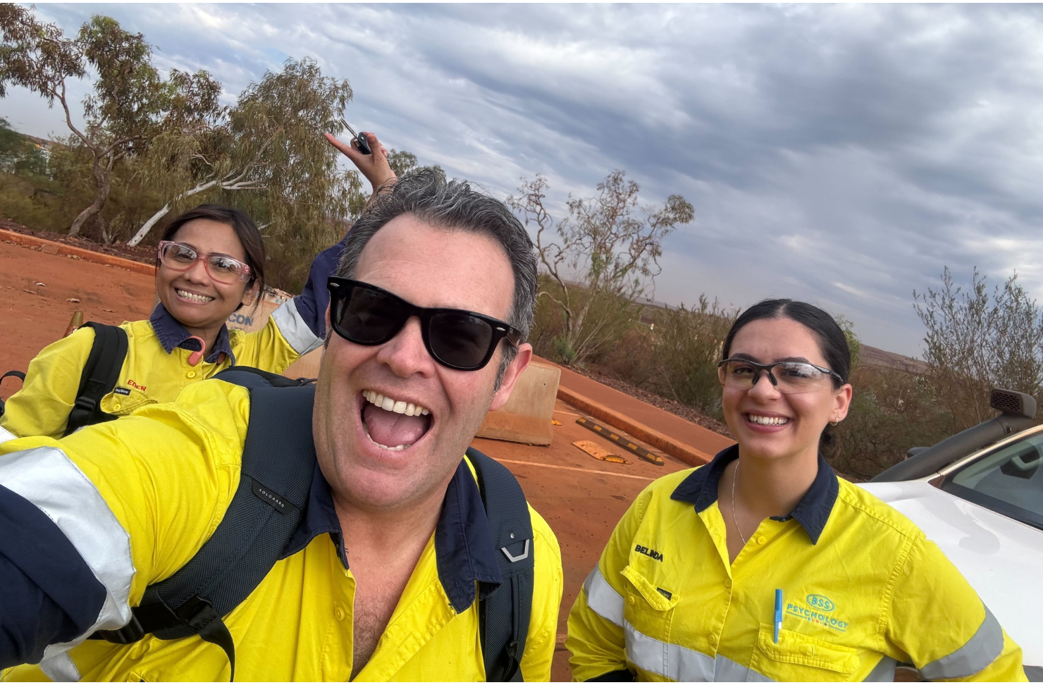 A selfie taken by Gus Worland with two girls in high vis gear