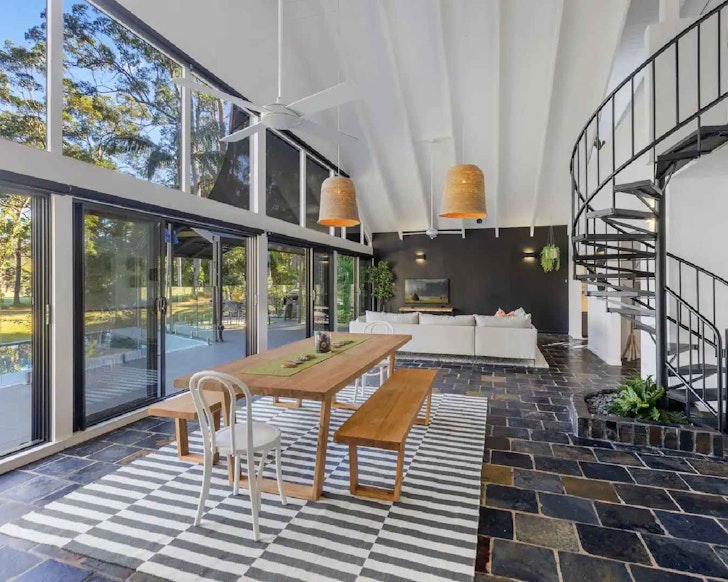 Large living room that opens out to pool area