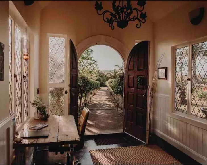 A view out the front door at Magnolia Manor Rustic Chapel one of the best pet-friendly Gold Coast stays