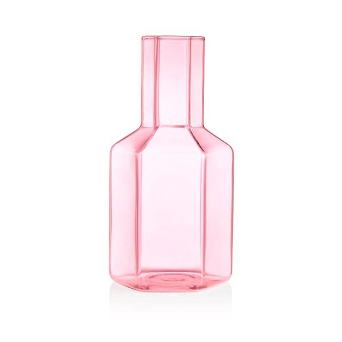 A pink glass carafe.