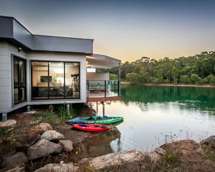 The outside of Maison du Lac on the lake kid friendly Airbnb near Perth