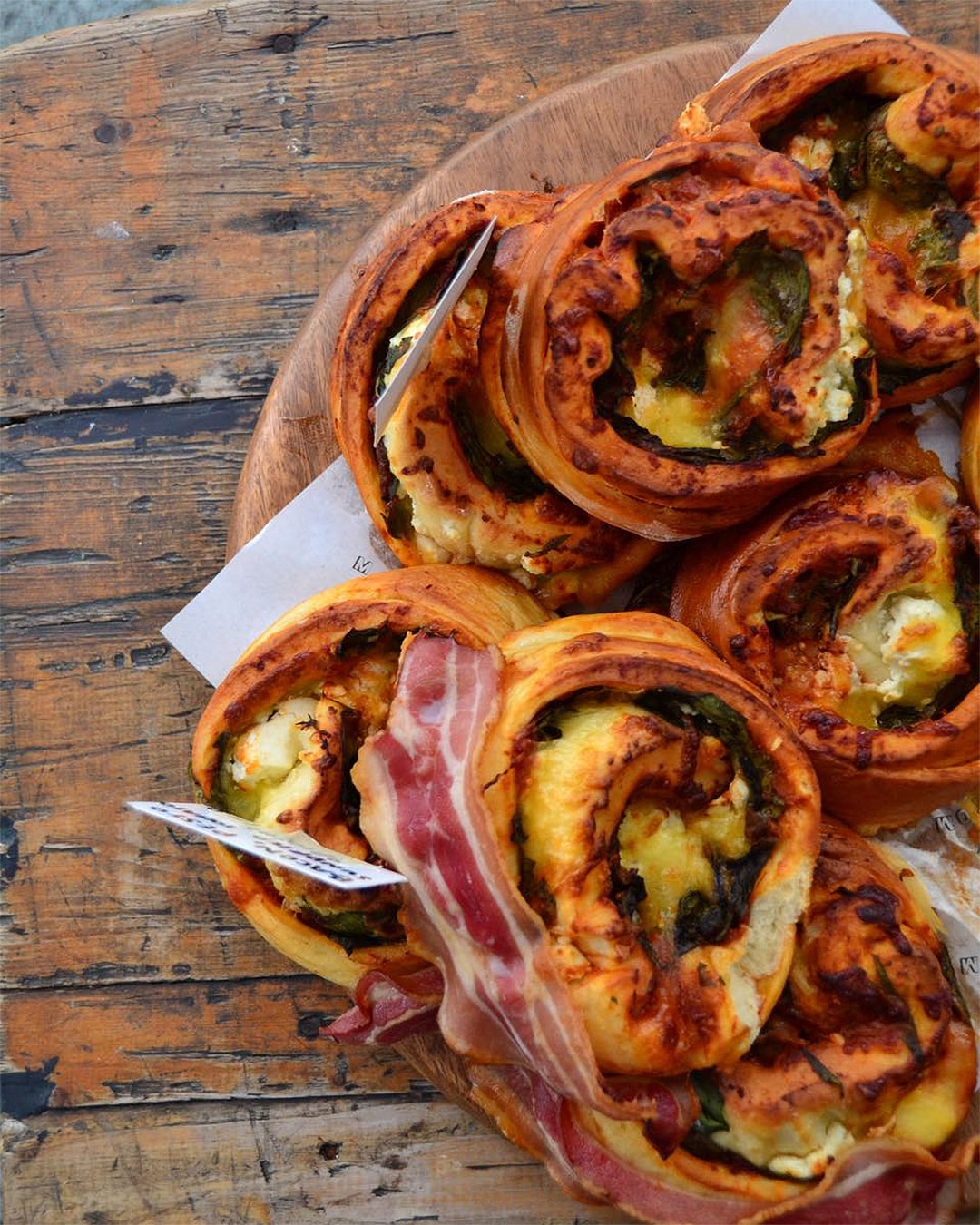 Delicious streaky bacon, spinach, relish and feta brioche