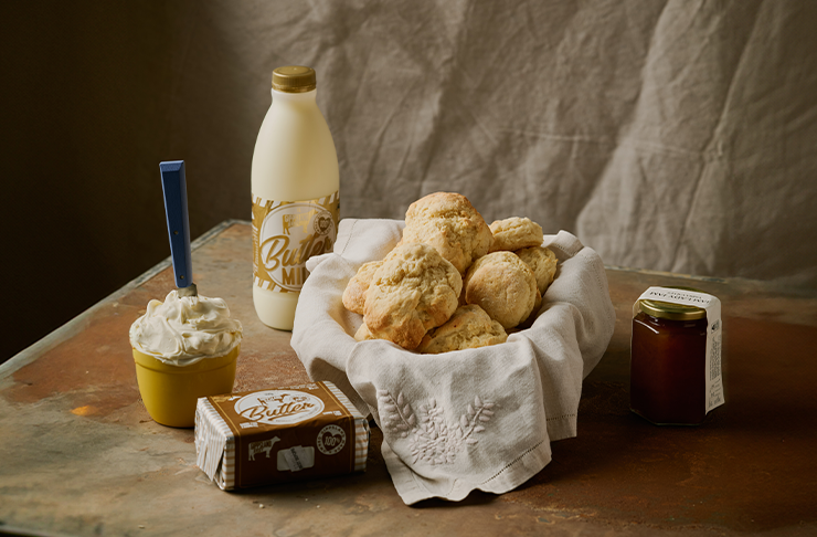 A basket of scones next to a bottle of buttermilk from Maker and Monger's DYI scones kit for Mother's Day in Melbourne