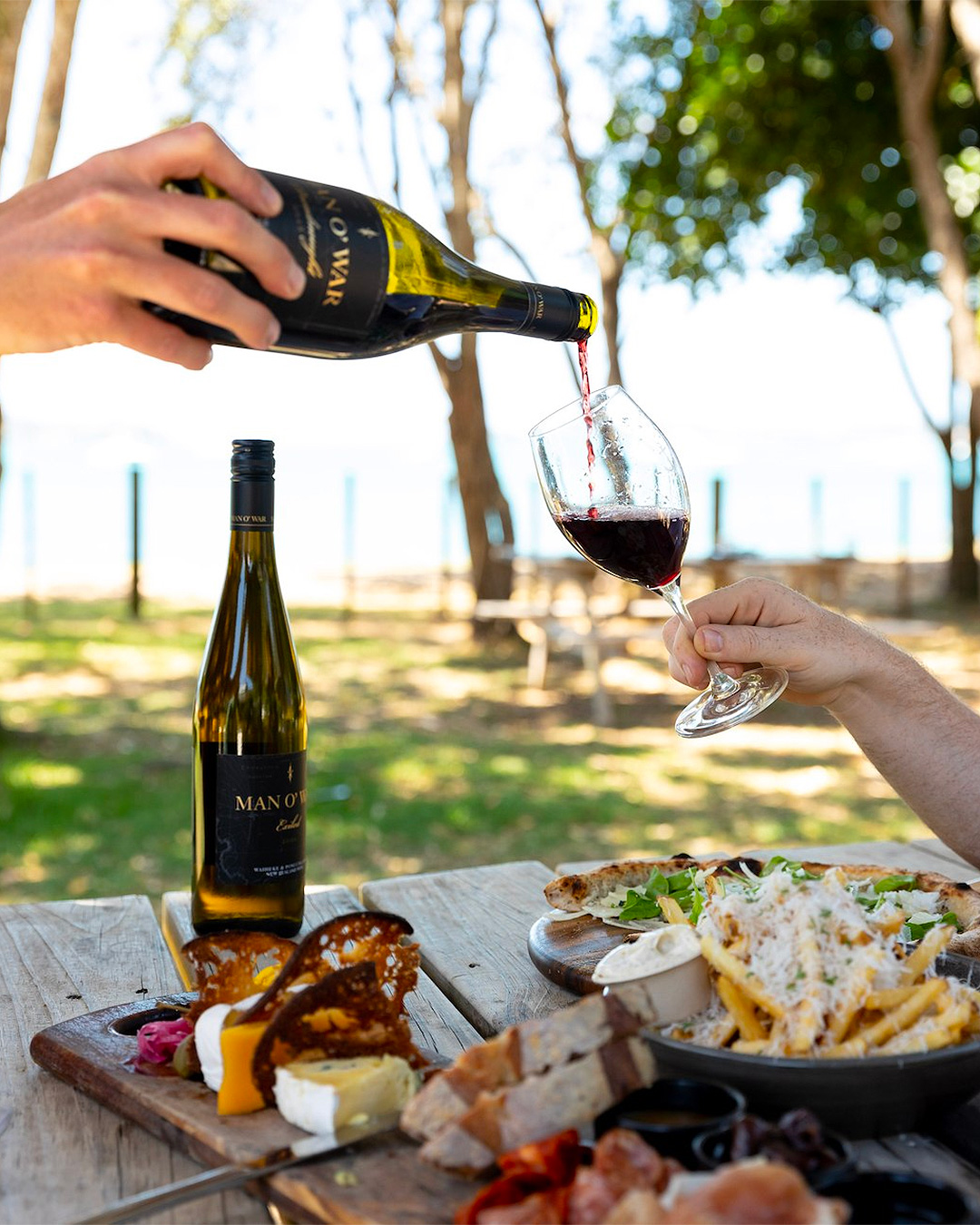 Someone pours out wine at Man O' War Vineyards.