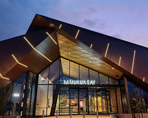 Manawa Bay exterior at night. 