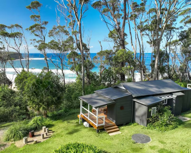 An exterior view of Mara Airtbnb with sea view and fire pit, one of the best accommodation options near Batemans Bay