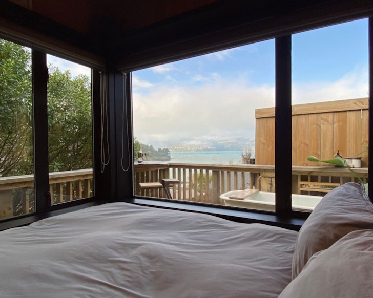 The view of the beach from Mariners Cabin one of the best beach house stays NZ