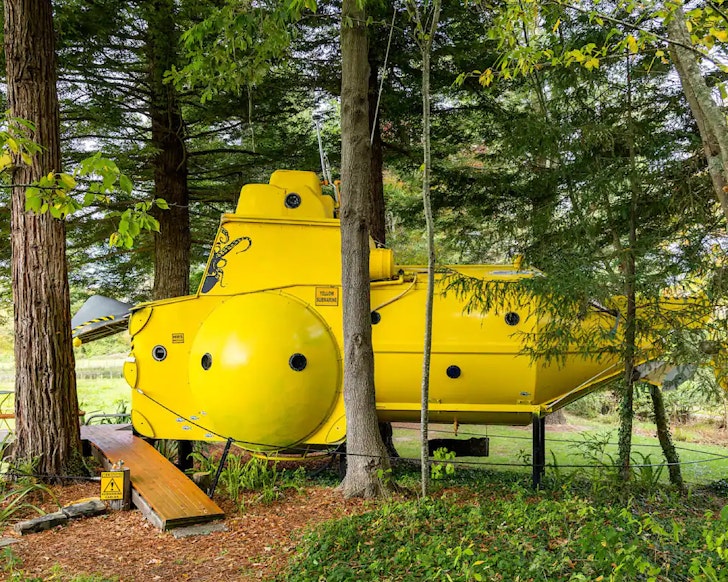 The exterior of the Yellow Submarine one of the best NZ Airbnbs