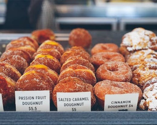 Rows of filled doughnuts at Mary Street Bakery in Claremont