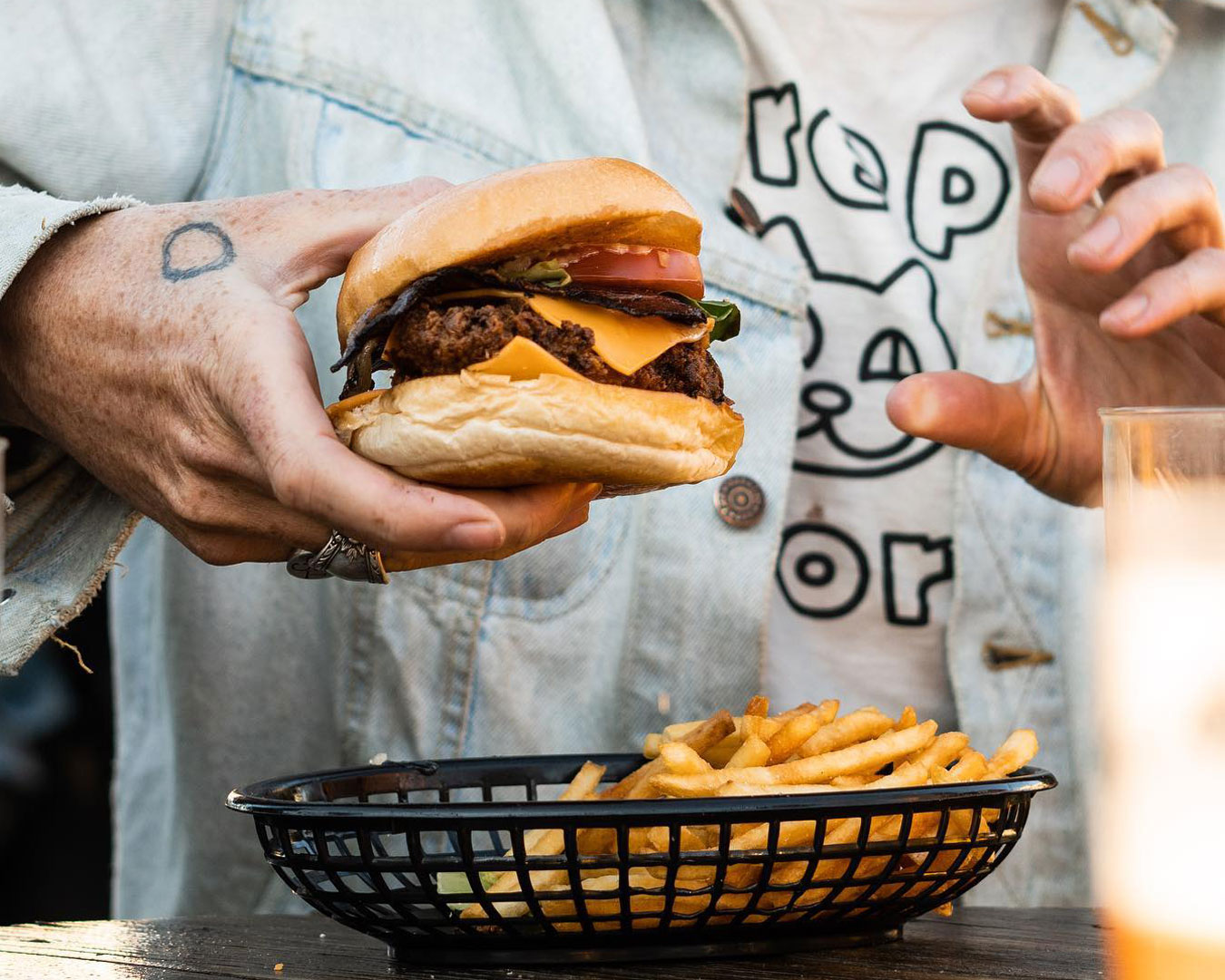 hand holding burger