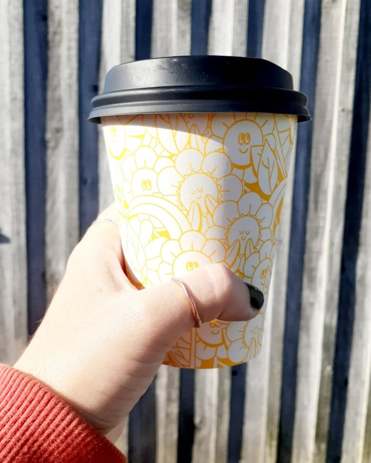 Coffee in the sunshine at Matakana Country Market, one of the best Auckland markets. 