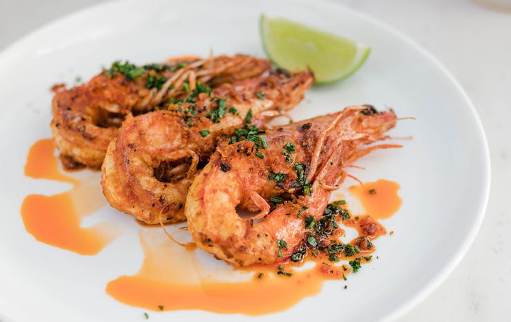 Grilled prawns on a plate.