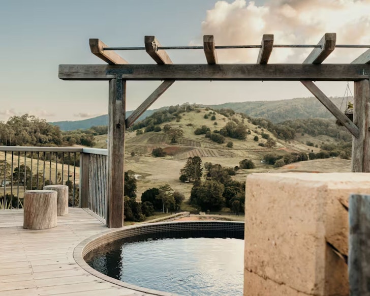 A view of the pool at Mayan Luxe Villas House which also has a bath with a view of the Sunshine Coast hinterland