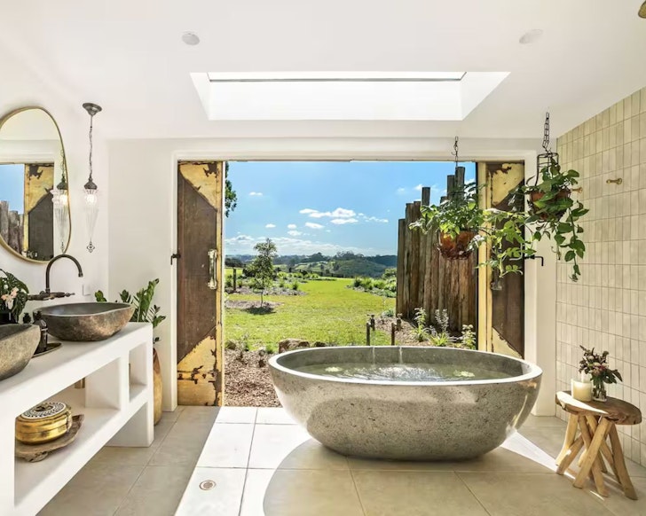 The stone bath with a view at Meadows Cottage one of the best Airbnbs near Byron Bay