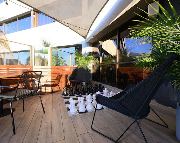 An oversized chessboard on a sun deck at the Mercure Hotel Penrith.