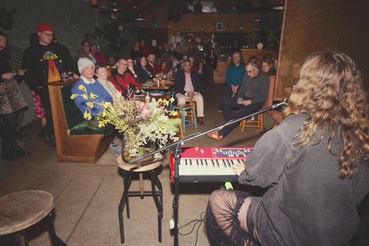 Musician performing to crowd.
