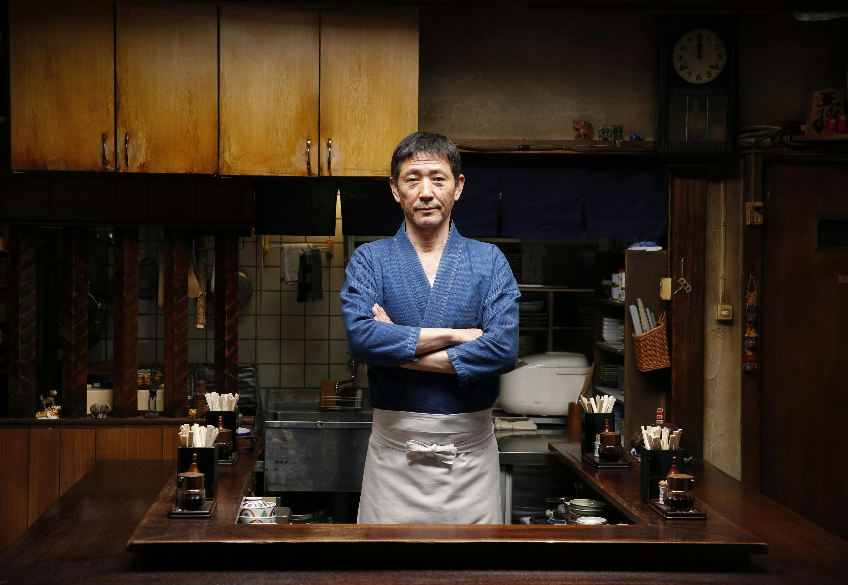 The Master from Midnight Diner posing in his little homely restaurant