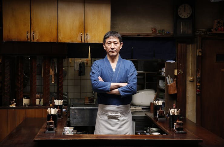 The Master from Midnight Diner posing in his little homely restaurant