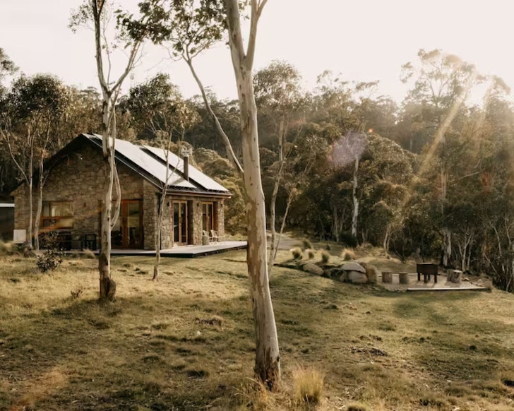 An exterior view of the stone Mill Cabin one of the best accommodation options in Jindabyne