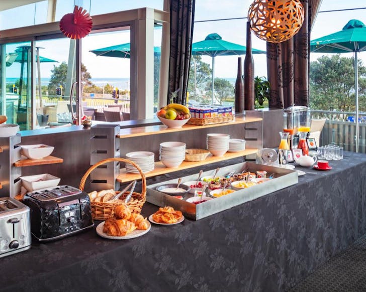 A continental breakfast buffet punctuated with pastries at the Millenium Hotel, one of the best hotels in New Plymouth. 