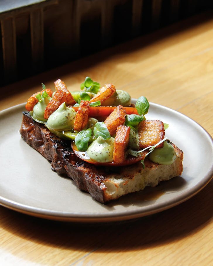 Heirloom tomatoes on toast with fried halloumi and avocado mousse at Miro. 