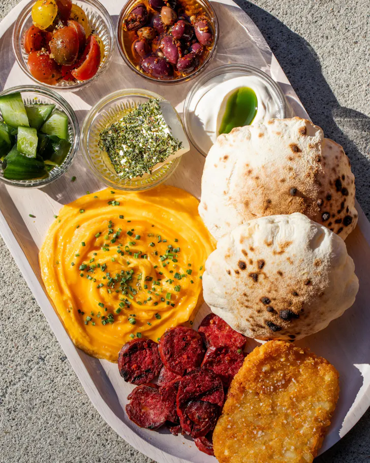 Puffy bread, fresh tomatoes, vegetables and dips at MISC. Parramatta