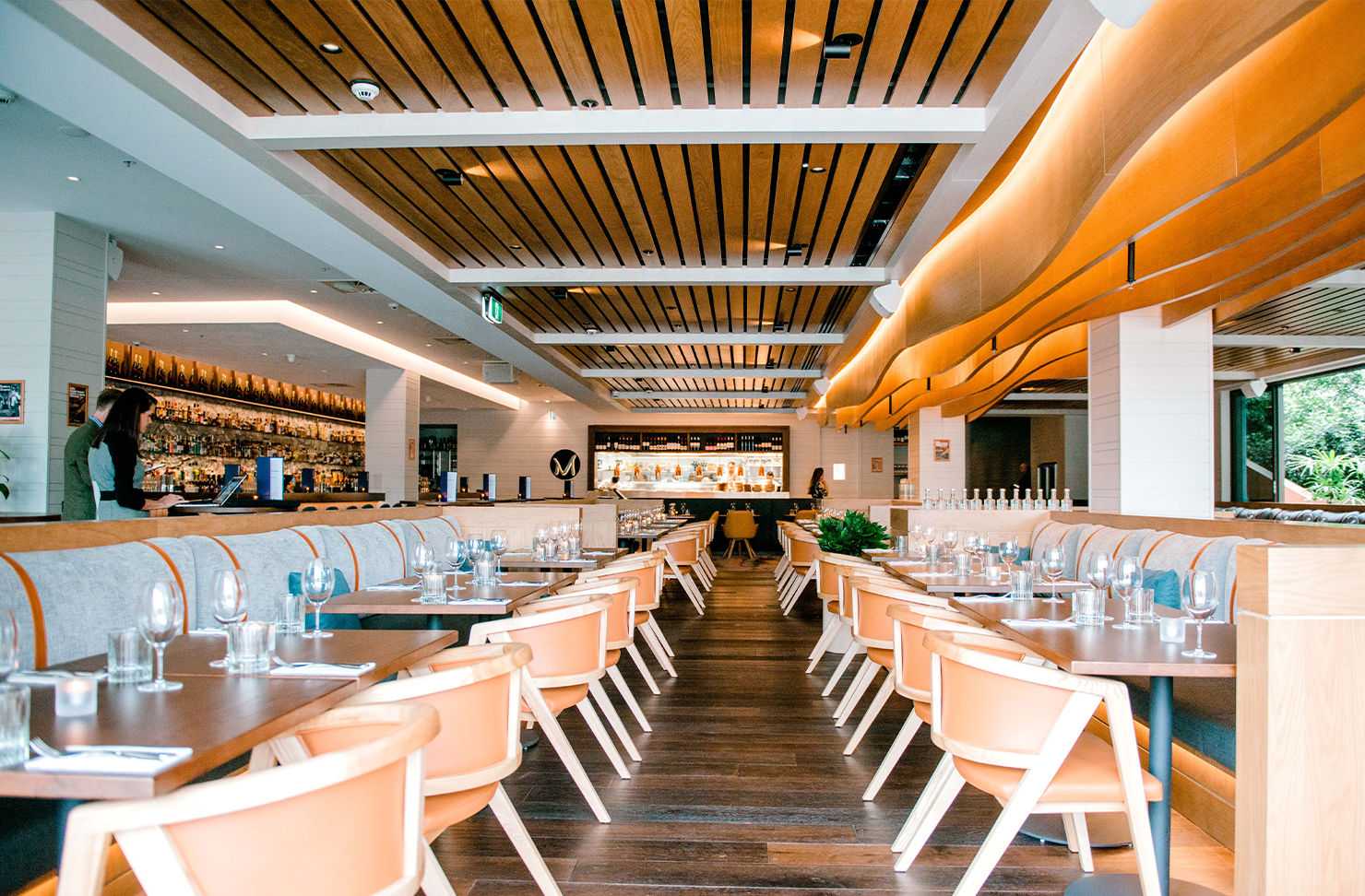 the interior of a large, wood-toned restaurant in broadbeach