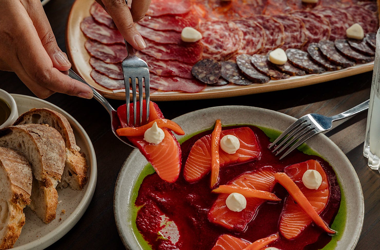 Hungry punters reach for some gorgeous seafood bites at MoVida.