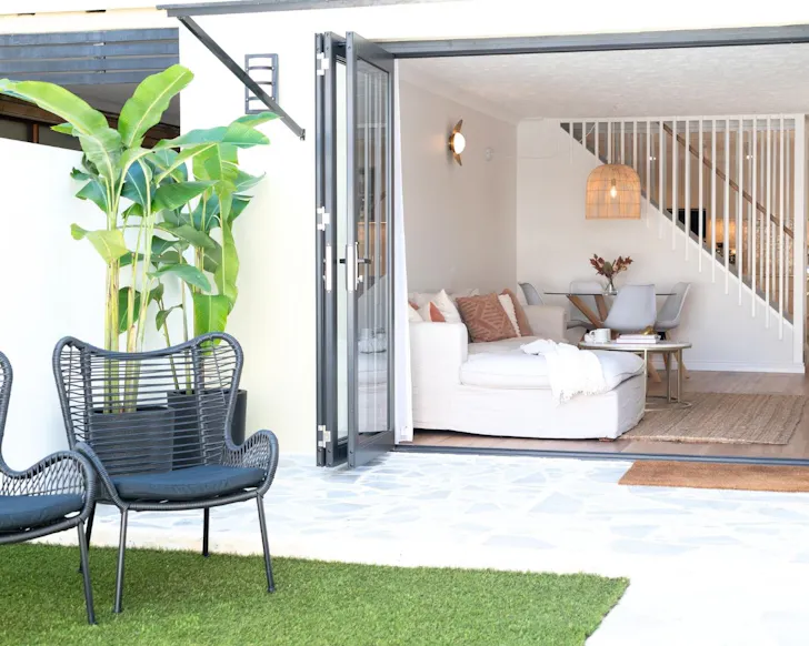 A view of the patio and living space at Modern Luxe Beach House one of the best pet-friendly Gold Coast stays
