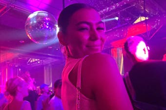 A woman posing in a club