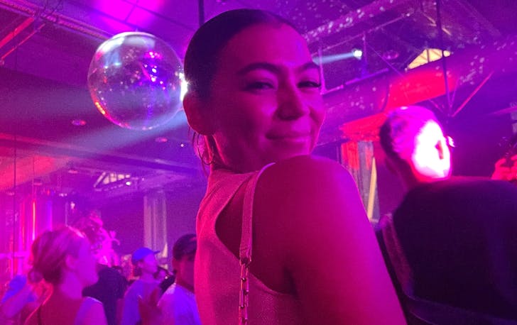 A woman posing in a club