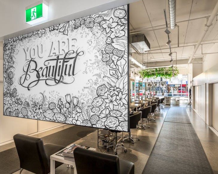 Interiors of the salon Morgan and Morgan. Includes a sign that says 'You are beautiful'.
