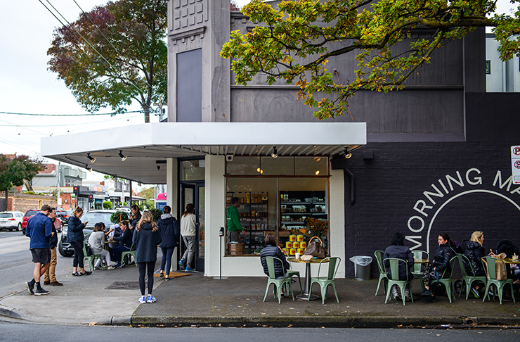 The exterior of the store, on a corner with a busy line