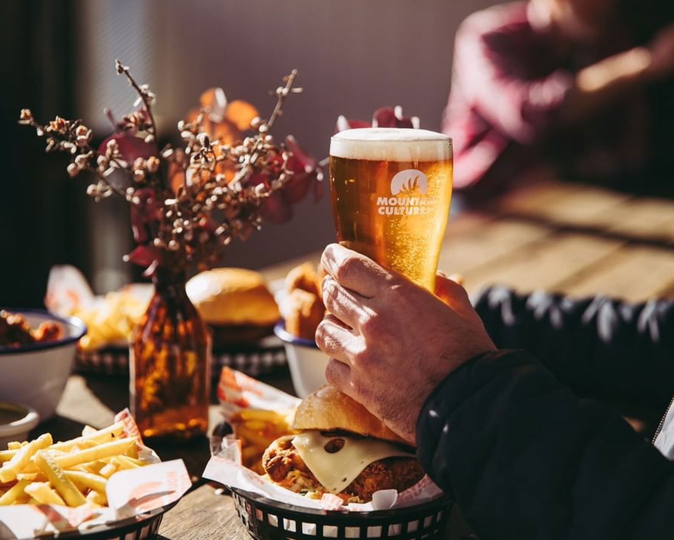 Hand holding beer